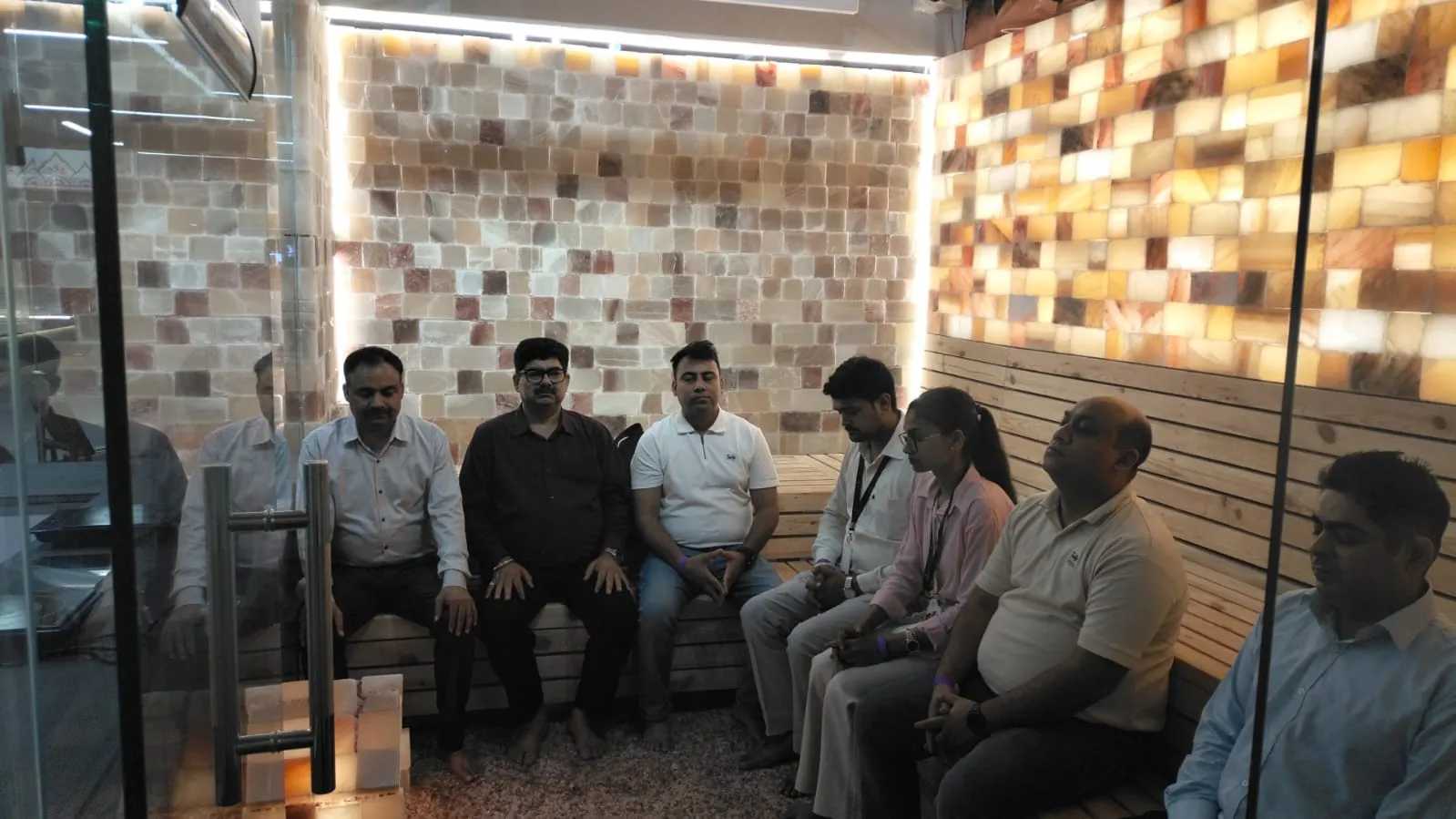 Corporate team getting the benefits of the Himalayan Salt Room.